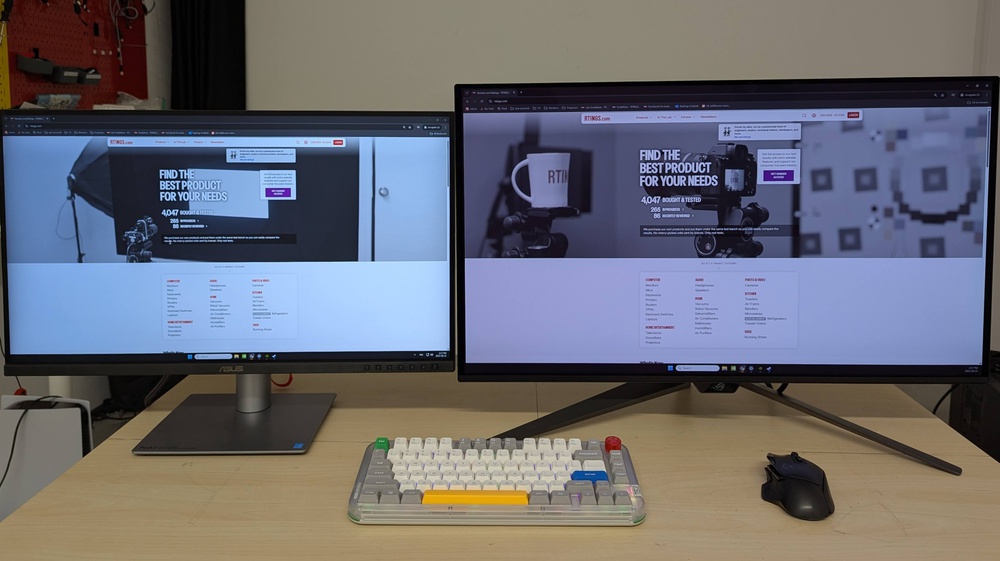 A 27-inch monitor next to a 32-inch monitor showing the difference in screen size.
