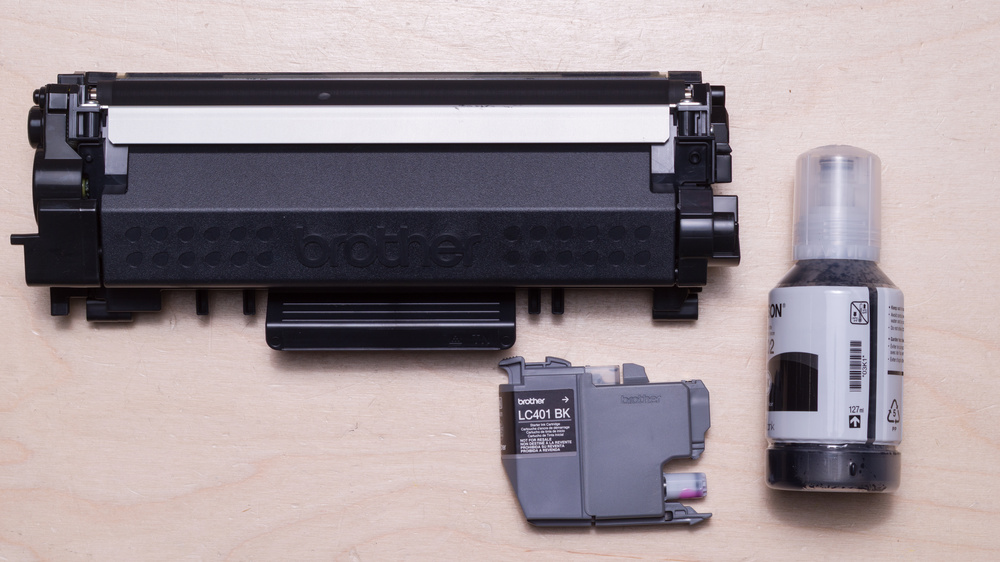 You can see a TN2420 toner cartridge used by many Brother laser printers on top, a regular LC401BK inkjet cartridge on the bottom, and an ink bottle that's used by Epson printer that use a supertank refillable cartridge on the right.
