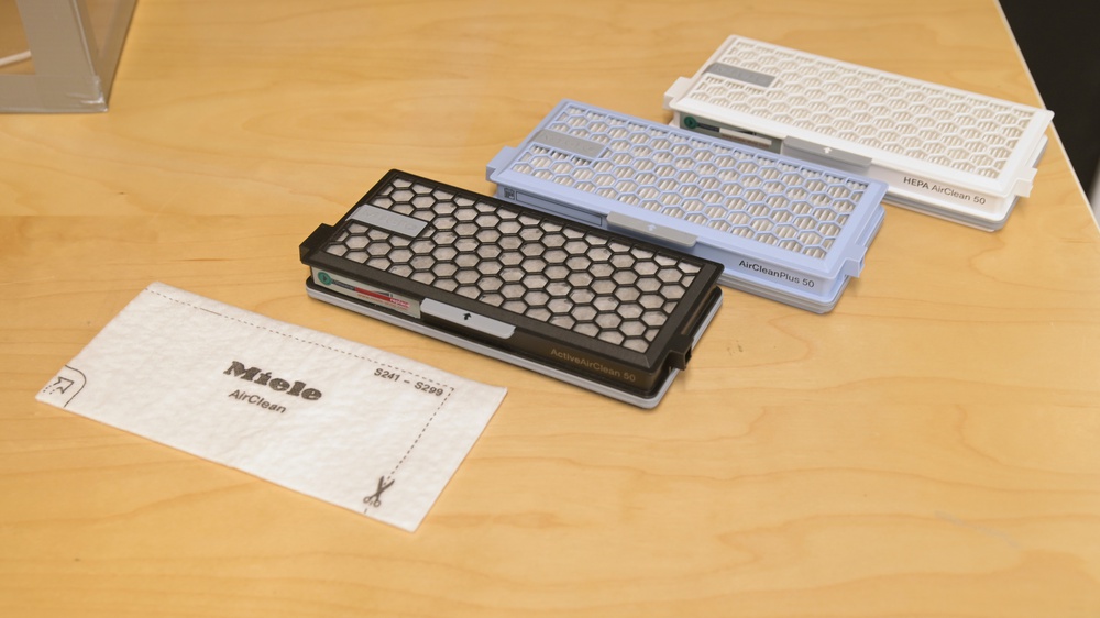 4 post-motor filters for the Miele C3 on a table.